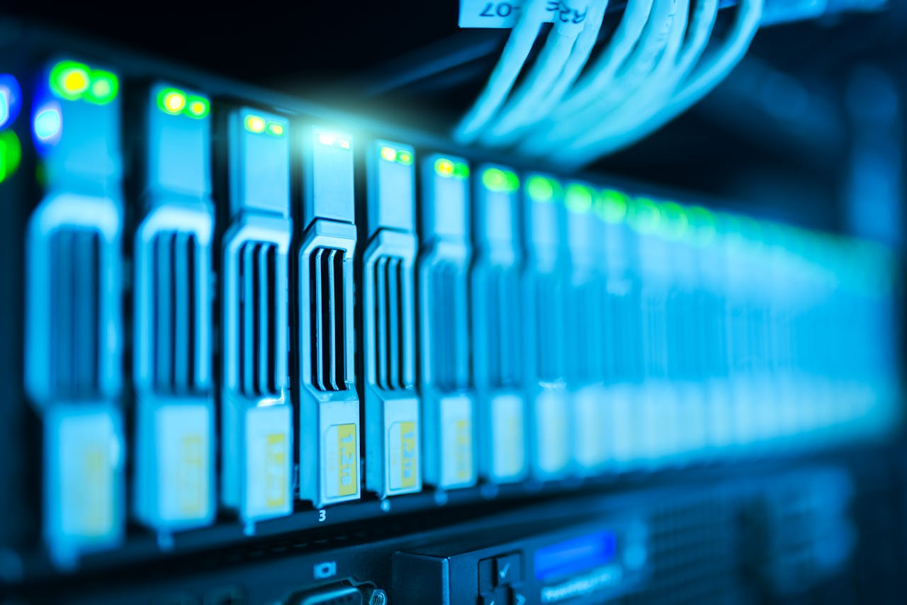 why-choose-us Detailed image of a server rack with glowing lights in a modern data center.